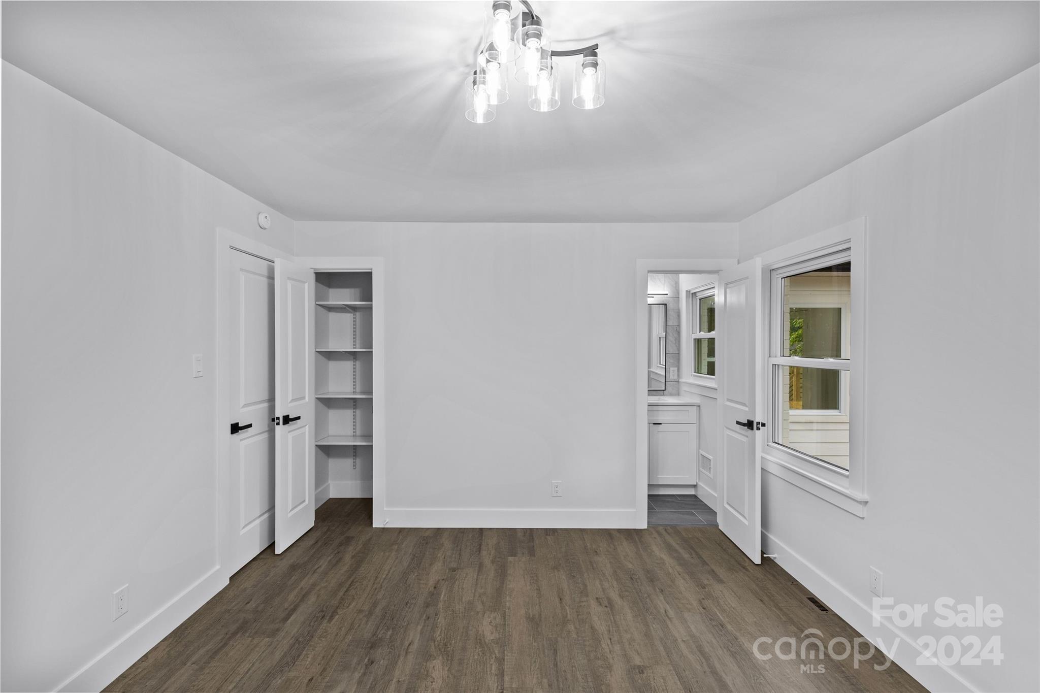 5745 Ruth Drive Charlotte, NC 28215 - Photo 28 of 42 wooden floor in an empty room with a window