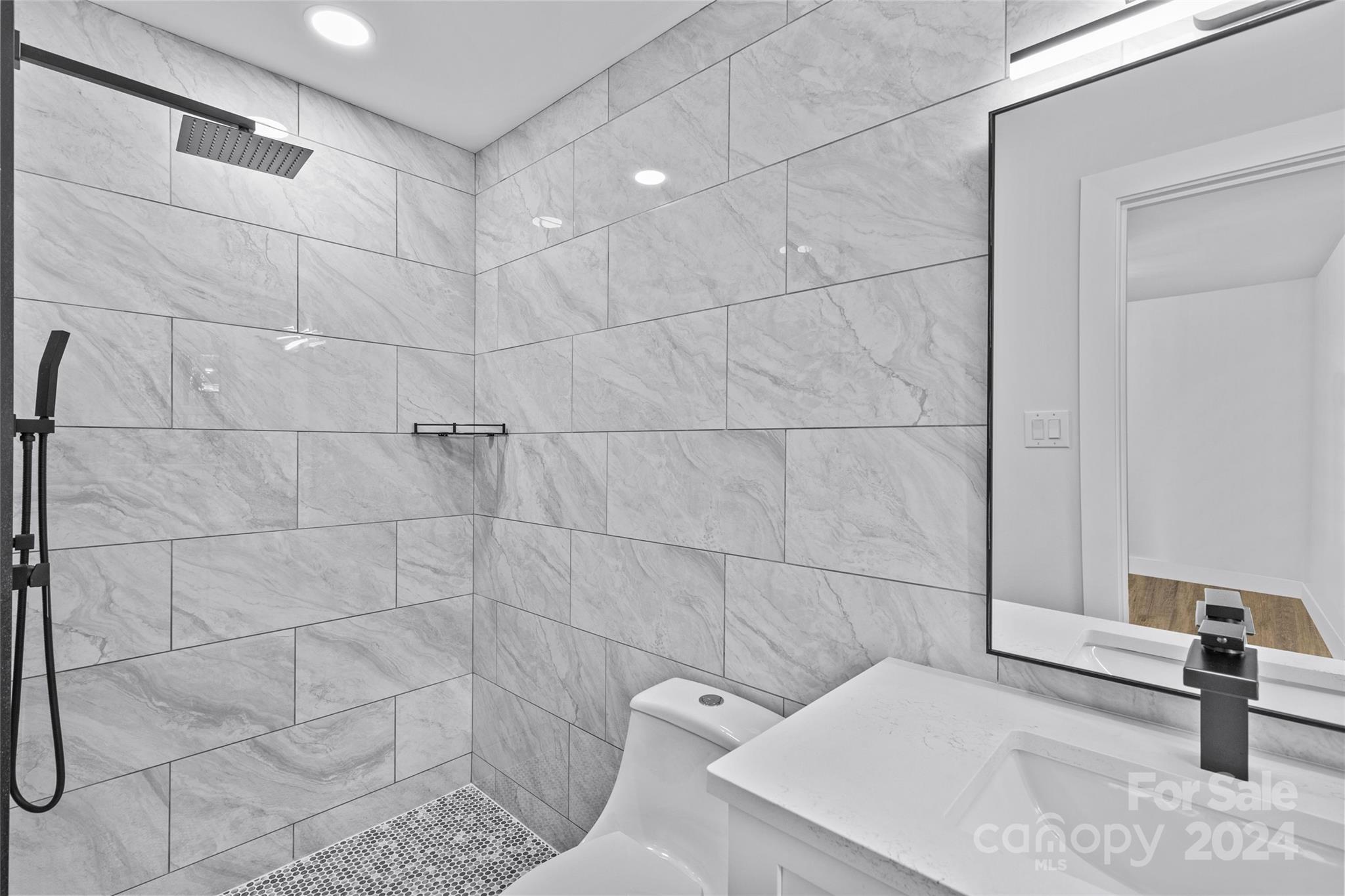 5745 Ruth Drive Charlotte, NC 28215 - Photo 31 of 42 a bathroom with a sink and a shower