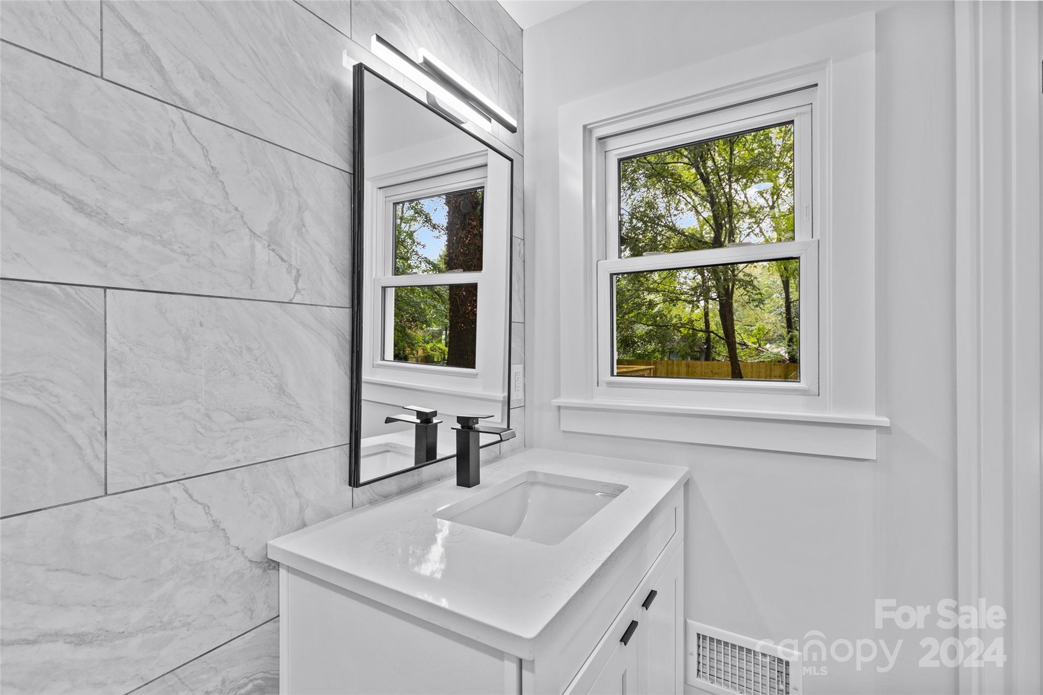 5745 Ruth Drive Charlotte, NC 28215 - Photo 33 of 42 a bathroom with a sink and a window