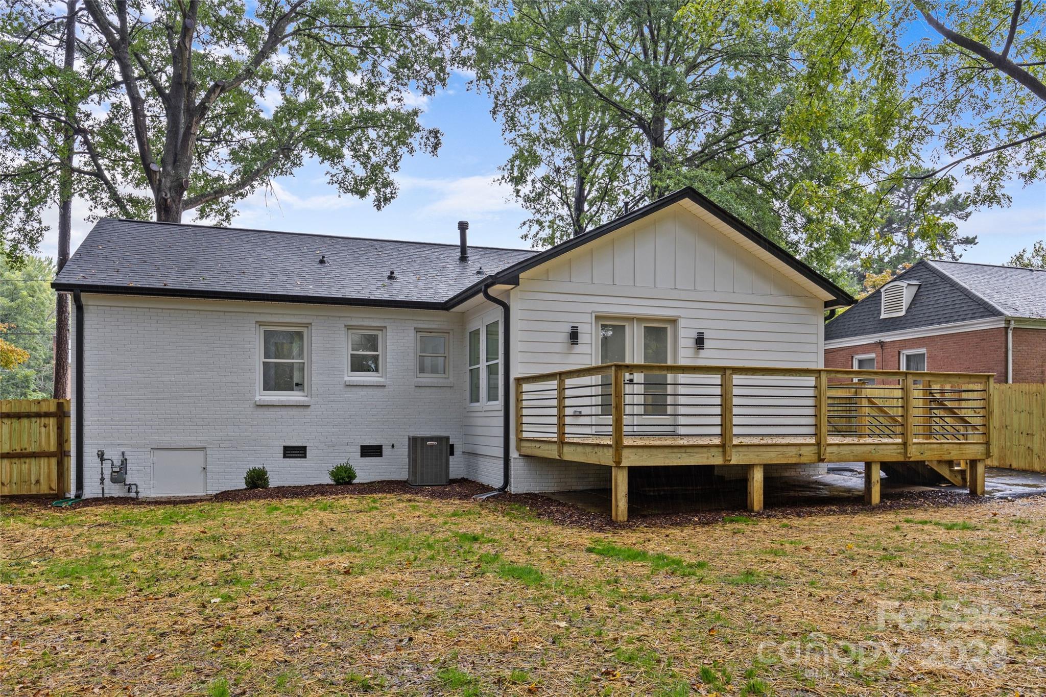 5745 Ruth Drive Charlotte, NC 28215 - Photo 41 of 42 a view of a house with a yard and wooden fence