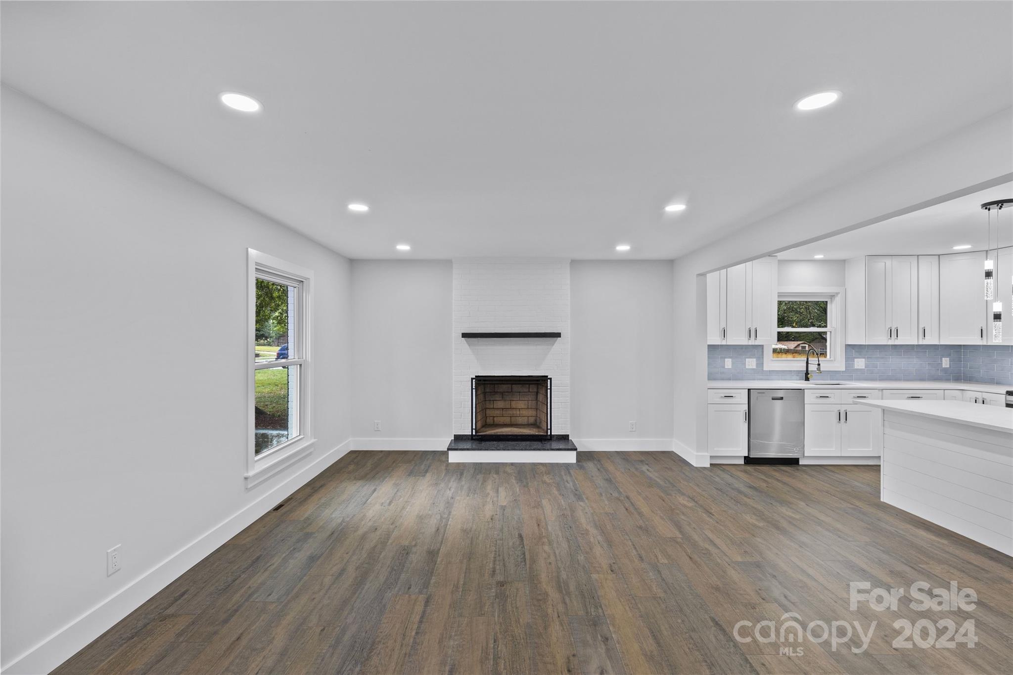 5745 Ruth Drive Charlotte, NC 28215 - Photo 6 of 42 a view of a kitchen with furniture and wooden floor