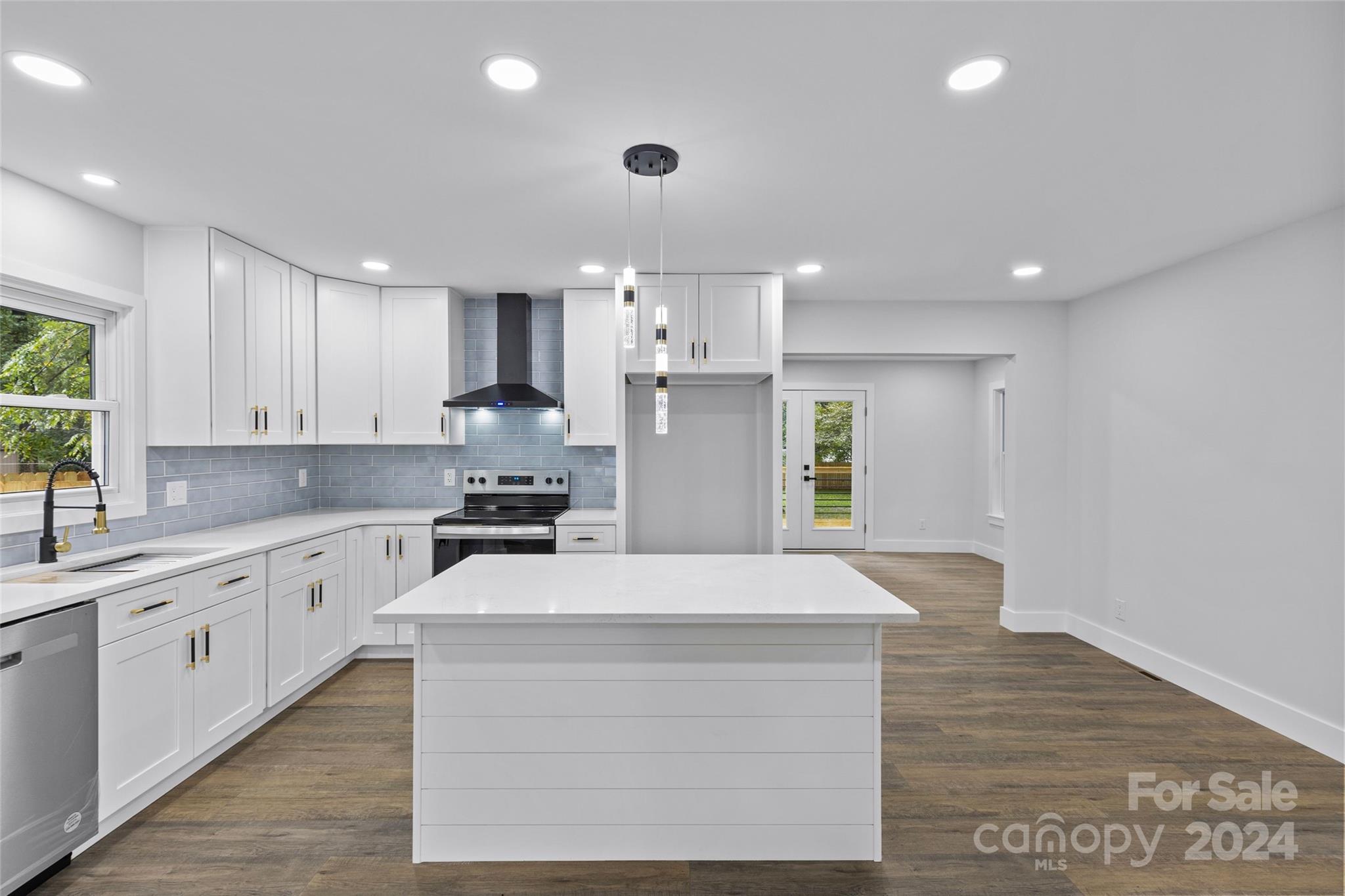 5745 Ruth Drive Charlotte, NC 28215 - Photo 9 of 42 a kitchen with a sink stainless steel appliances and cabinets
