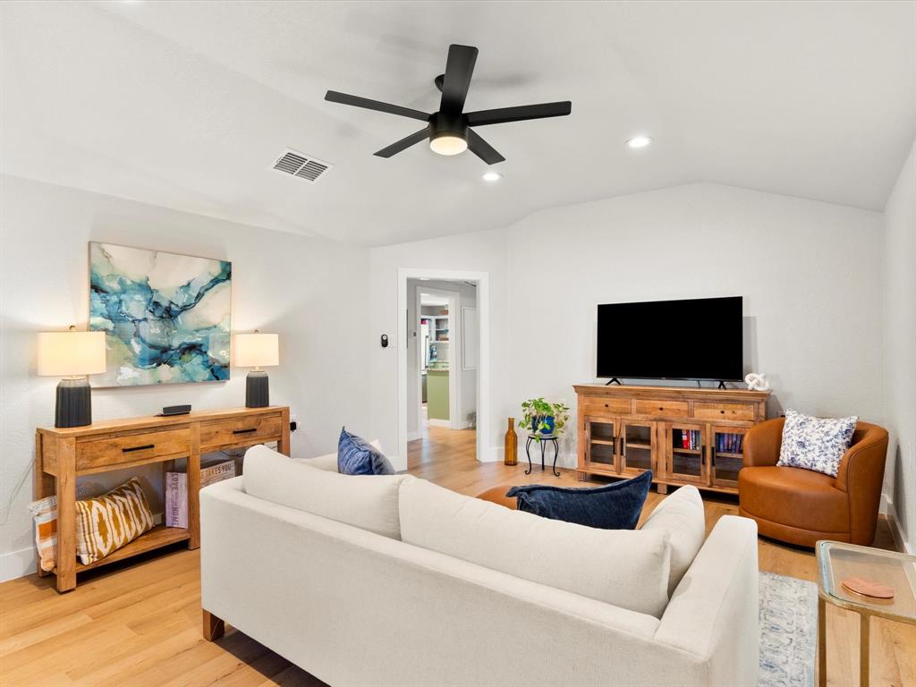 901 South Lane Street Decatur, TX 76234 - Photo 4 of 23 Living room with vaulted ceiling, ceiling fan, and light hardwood / wood-style floors