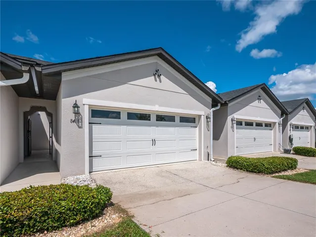 a front view of a house with a garage