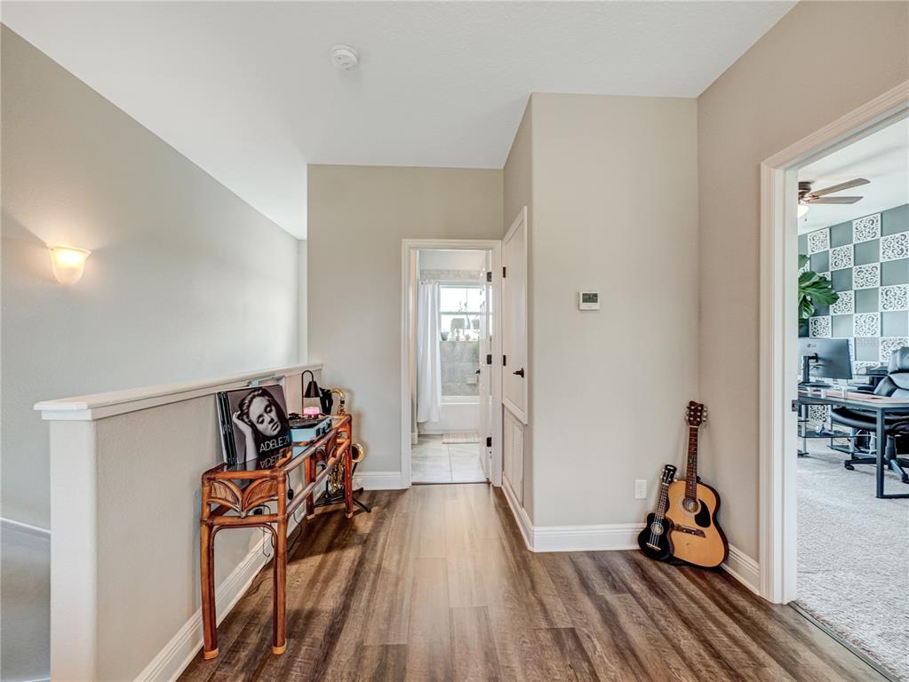 8416 Magnificent Road Groveland, FL 34736 - Photo 22 of 28 a view of a room with gym equipment
