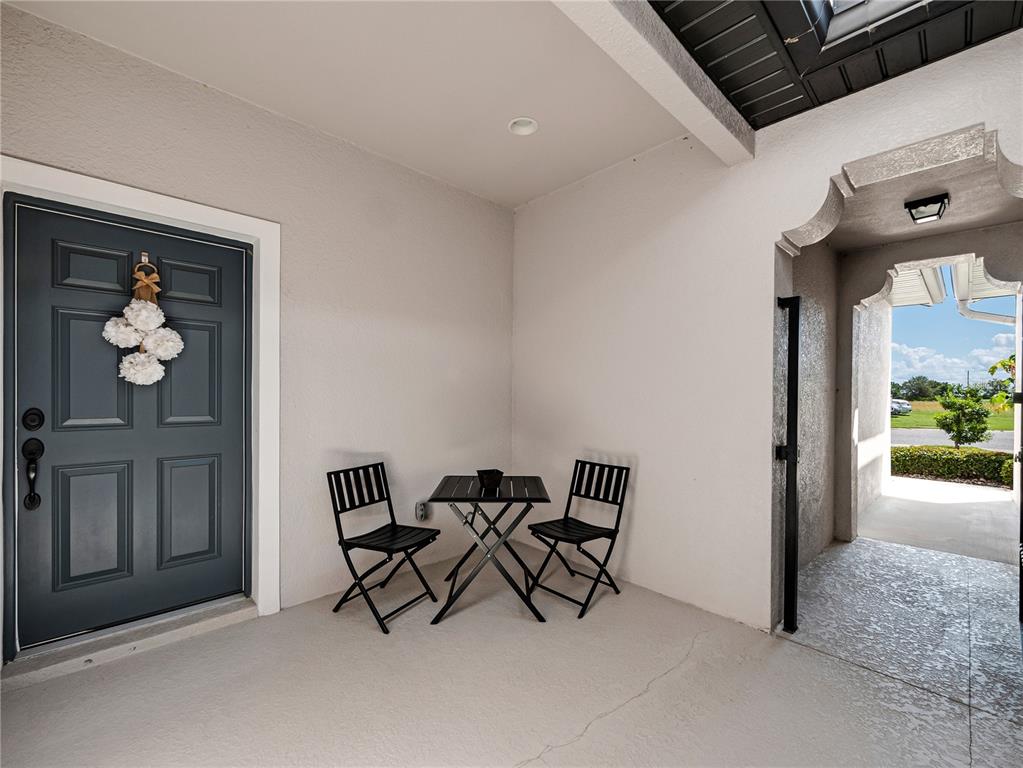 8416 Magnificent Road Groveland, FL 34736 - Photo 3 of 28 a view of a hallway with seating area