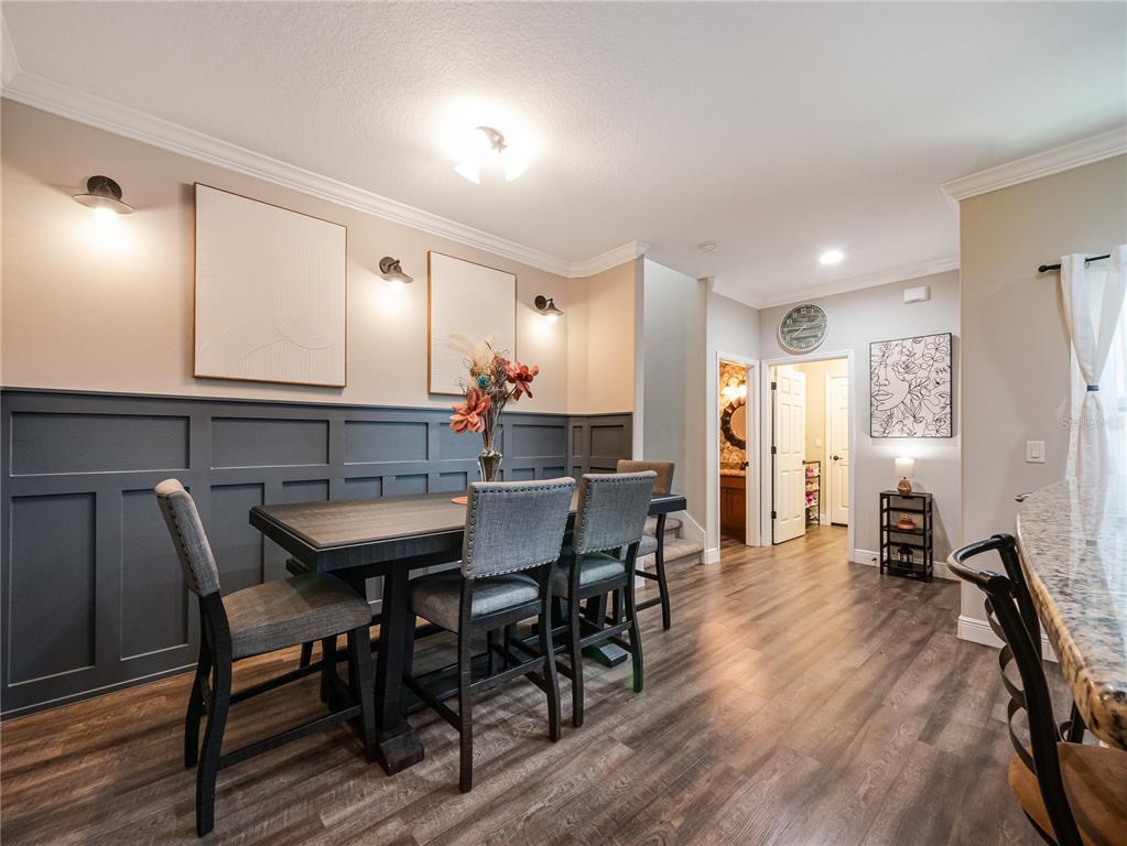 8416 Magnificent Road Groveland, FL 34736 - Photo 6 of 28 a view of a a dining room with furniture window and wooden floor