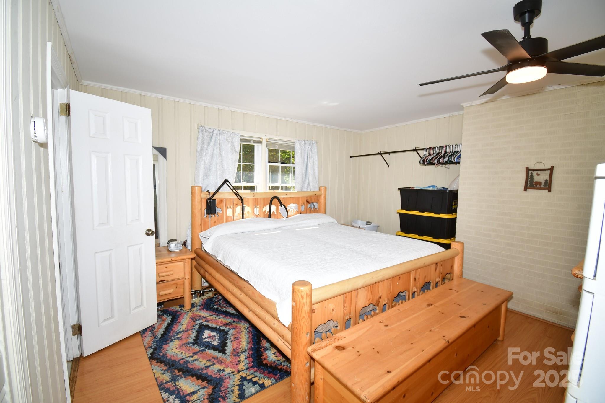 3048 Timrod Road Bethune, SC 29009 - Photo 17 of 26 a bedroom with a bed and a chandelier
