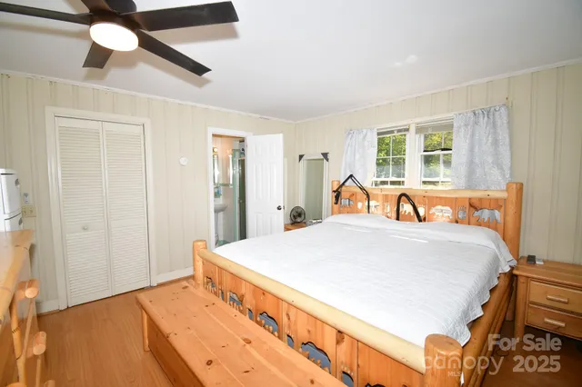 a bed room with a bed and a dresser