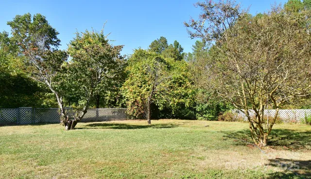 a view of a patio with a dining table and chairs