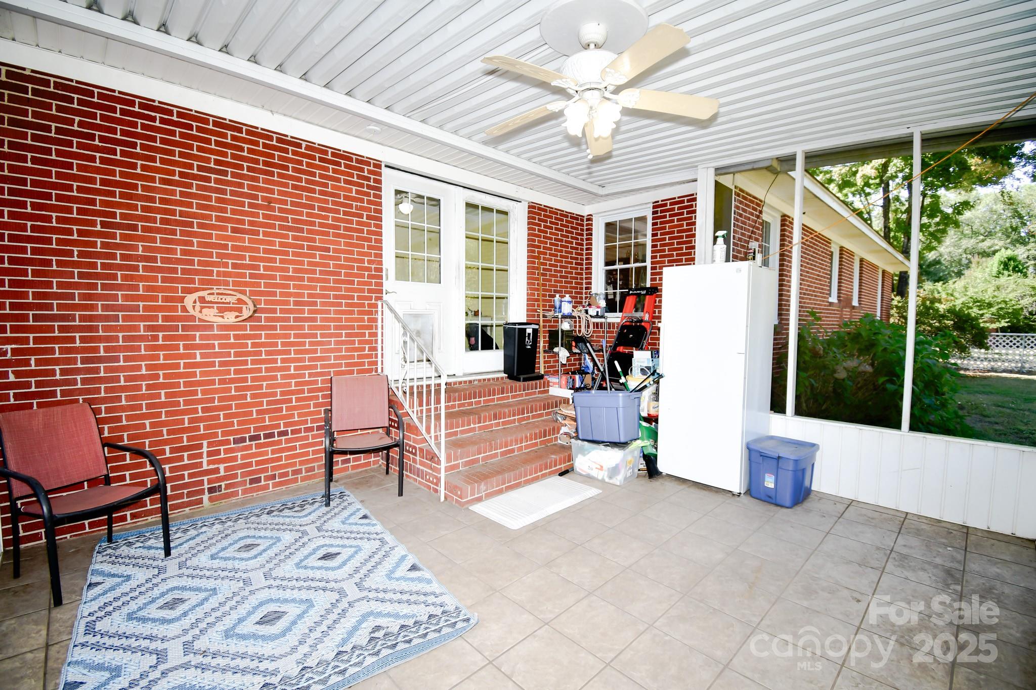 3048 Timrod Road Bethune, SC 29009 - Photo 24 of 26 a view of a patio with a dining table and chairs