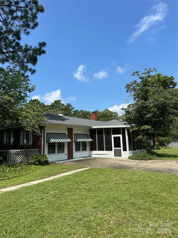 a house view with a garden space