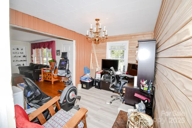 a view of a livingroom with workspace and a couch