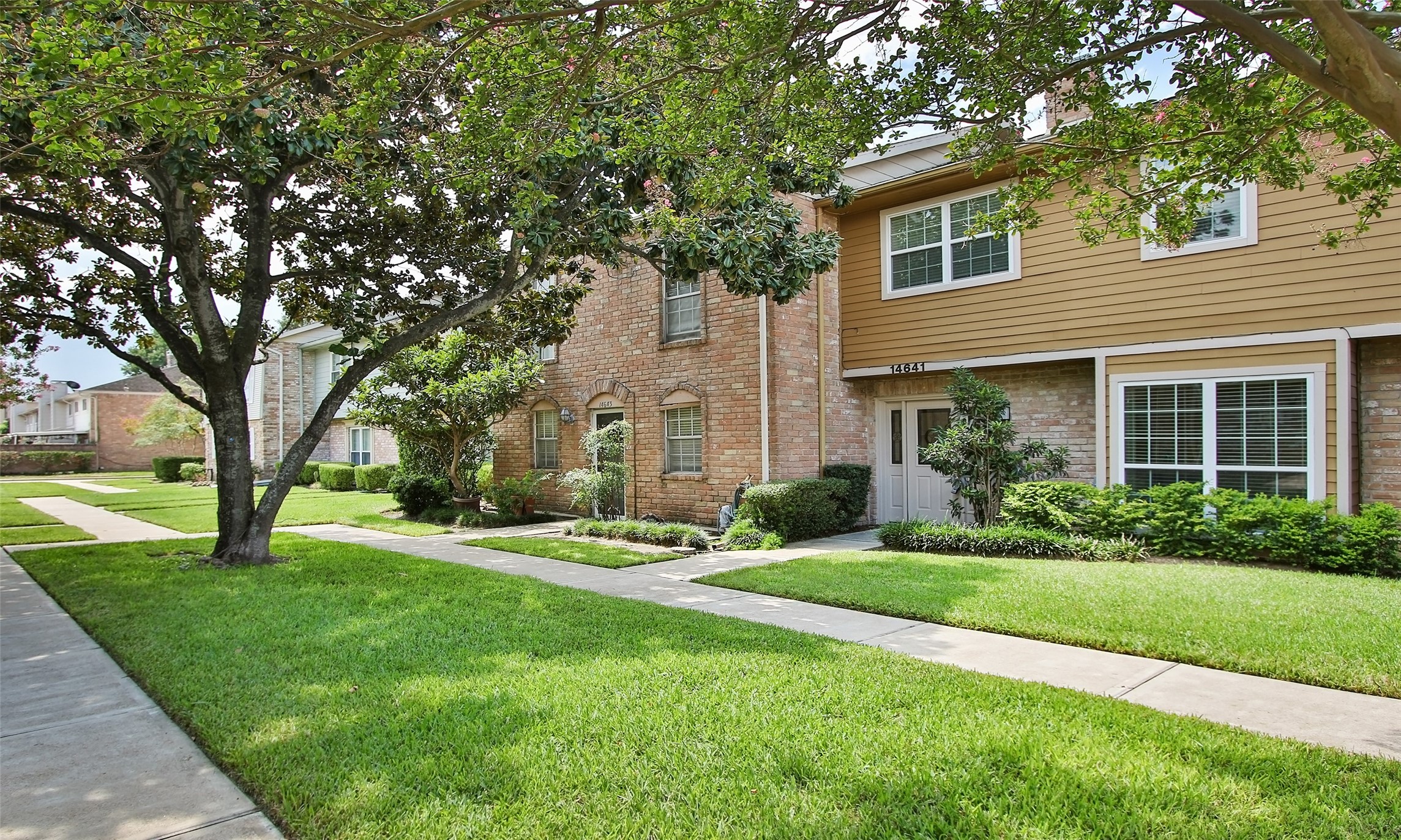 14641 Perthshire Road Houston, TX 77079 - Photo 2 of 37 Unit faces this quiet, tree-lined courtyard.