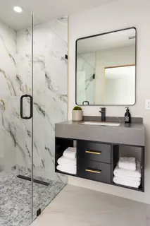 a bathroom with a double vanity sink a mirror and shower