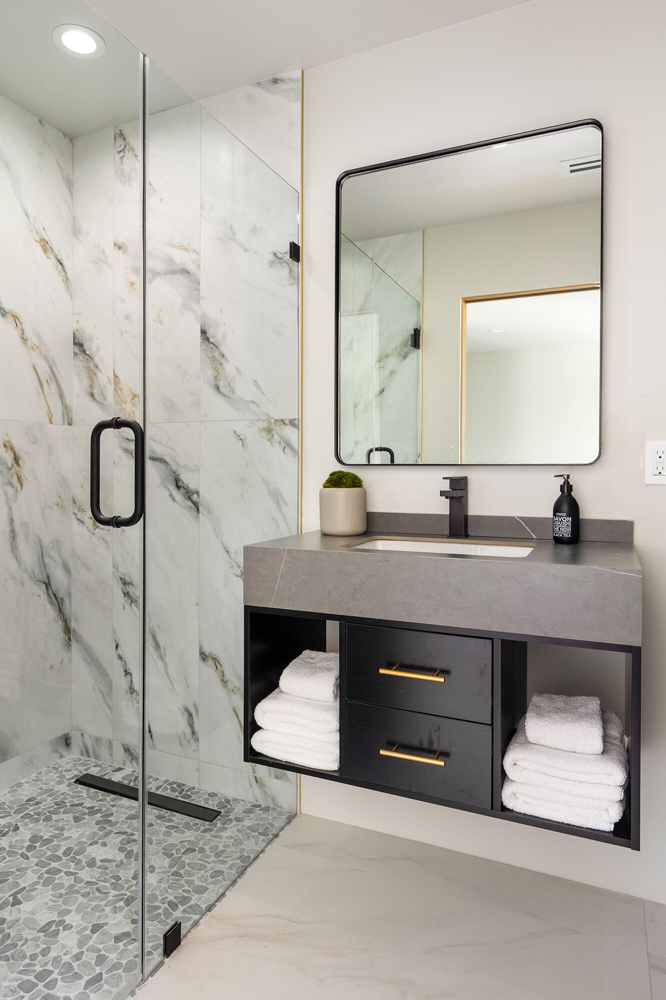 71501 Sahara Road Rancho Mirage, CA 92270 - Photo 16 of 29 a bathroom with a double vanity sink a mirror and shower