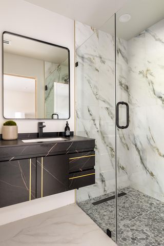 a bathroom with a tub sink and mirror