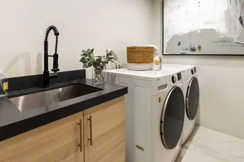 a view of sink and washer dryer