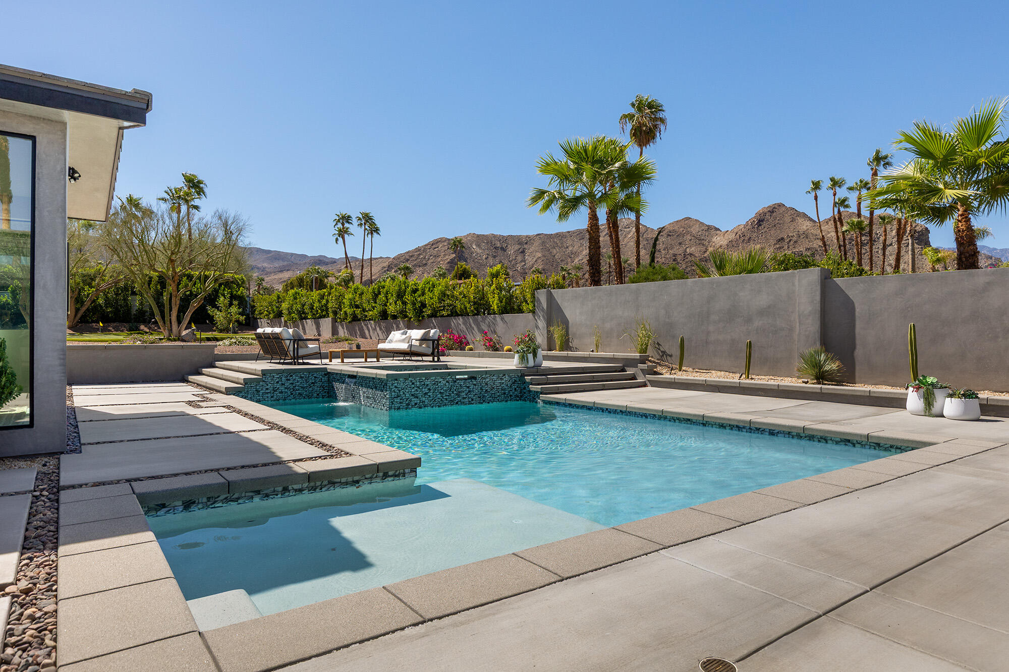 71501 Sahara Road Rancho Mirage, CA 92270 - Photo 23 of 29 a view of a swimming pool and a yard