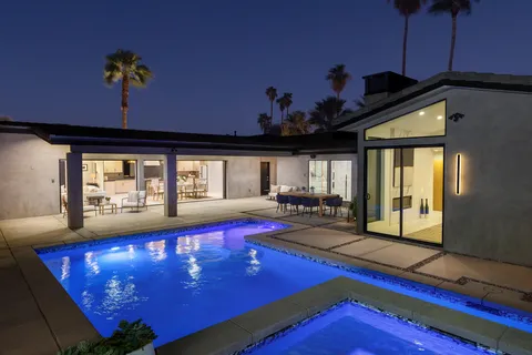 a view of swimming pool with a living room