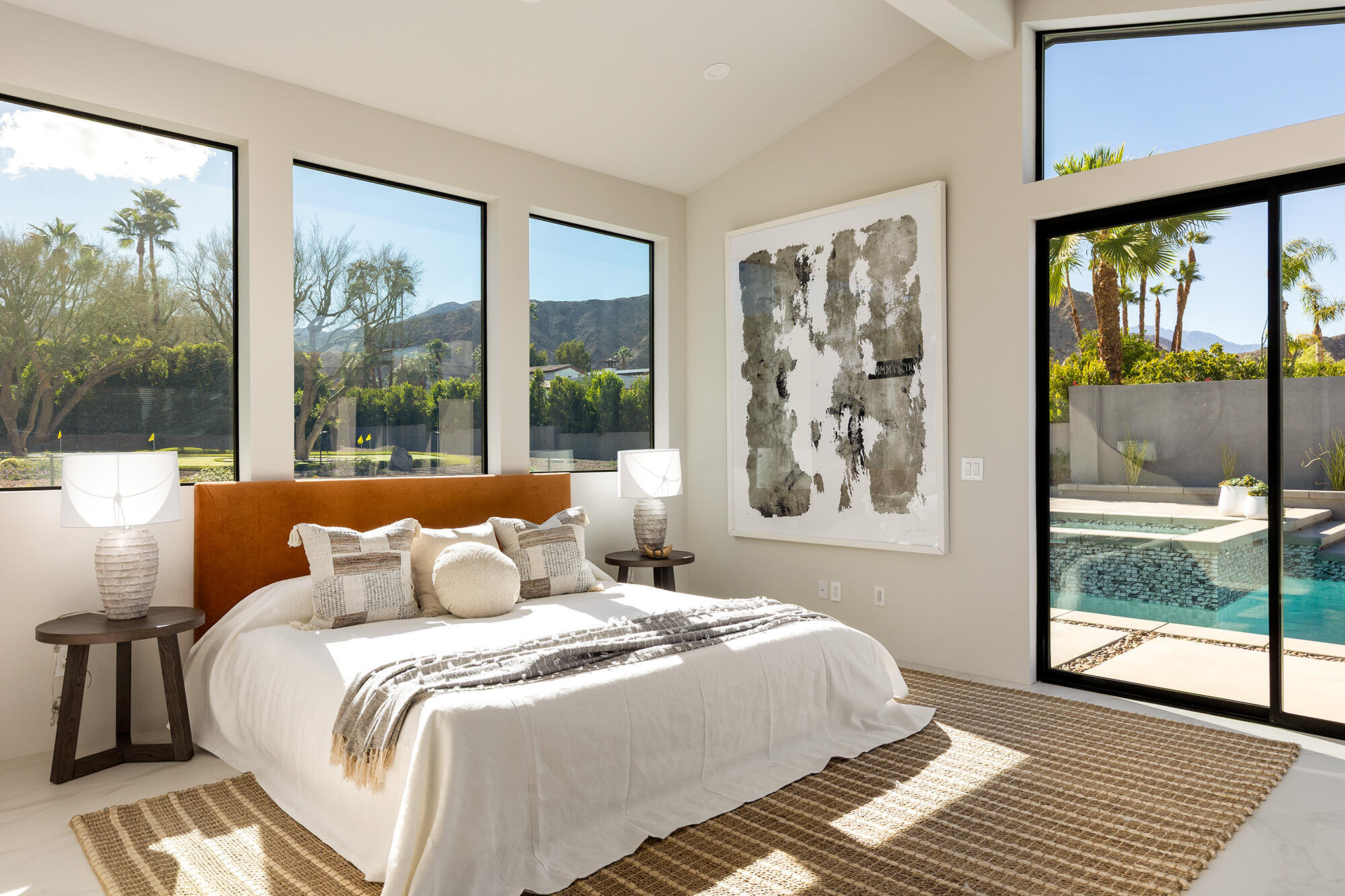 71501 Sahara Road Rancho Mirage, CA 92270 - Photo 10 of 29 a bedroom with a large window and a bed
