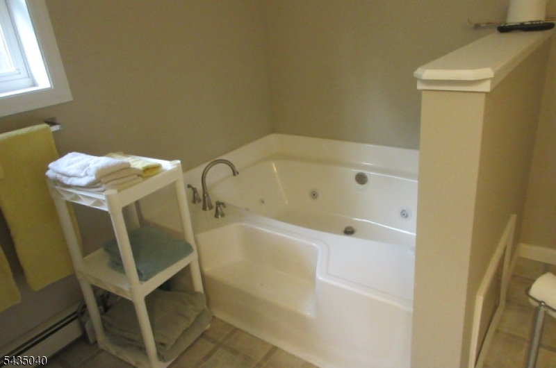 28 Beaver Run Road Lafayette, NJ 07848 - Photo 15 of 36 a bathroom with a tub and sink
