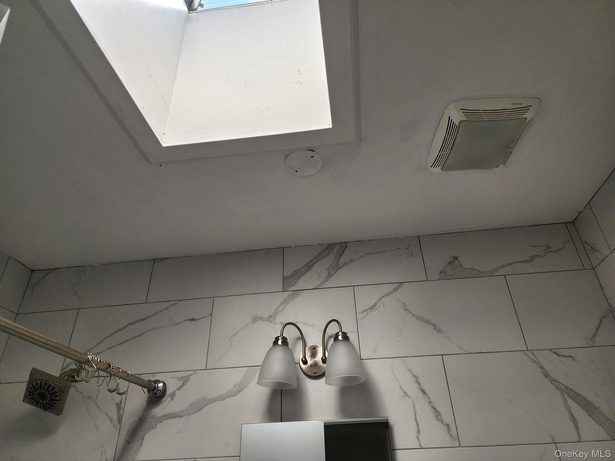 45-01 Ditmars Boulevard, Unit 2R Queens, NY 11105 - Photo 13 of 13 a view of bathroom