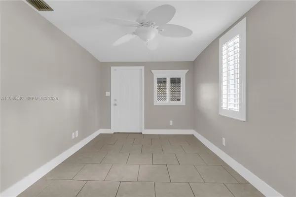 a view of an empty room with a window