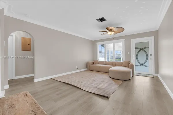 a living room with furniture and a window