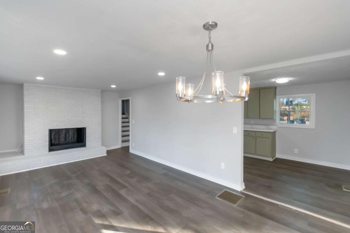 1829 Joy Lake Road Morrow, GA 30260 - Photo 6 of 26 a view of a livingroom with a dishwasher cabinets and a kitchen counter space