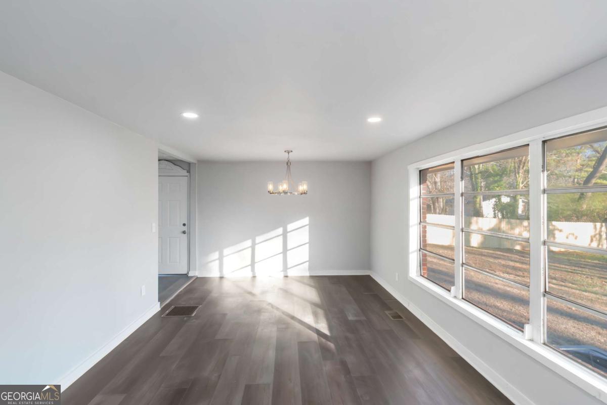 1829 Joy Lake Road Morrow, GA 30260 - Photo 7 of 26 a view of empty room with wooden floor and fan