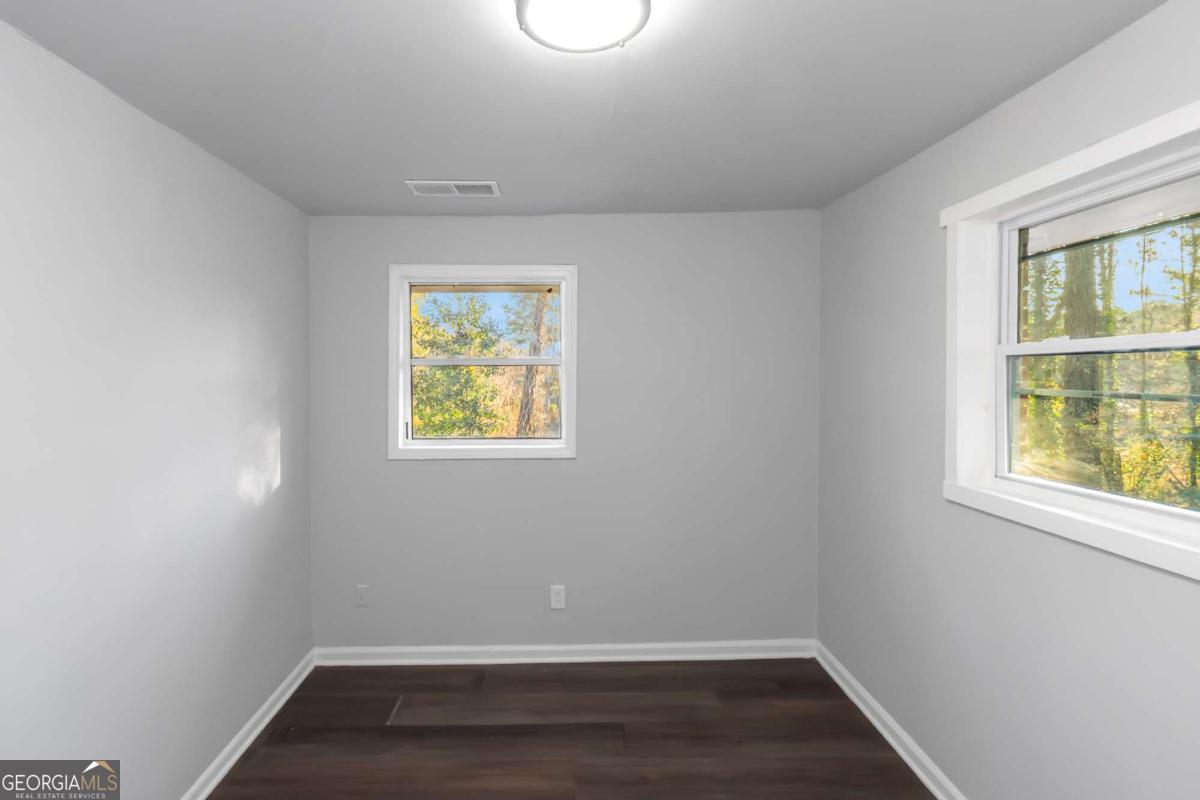 1829 Joy Lake Road Morrow, GA 30260 - Photo 8 of 26 an empty room with a window