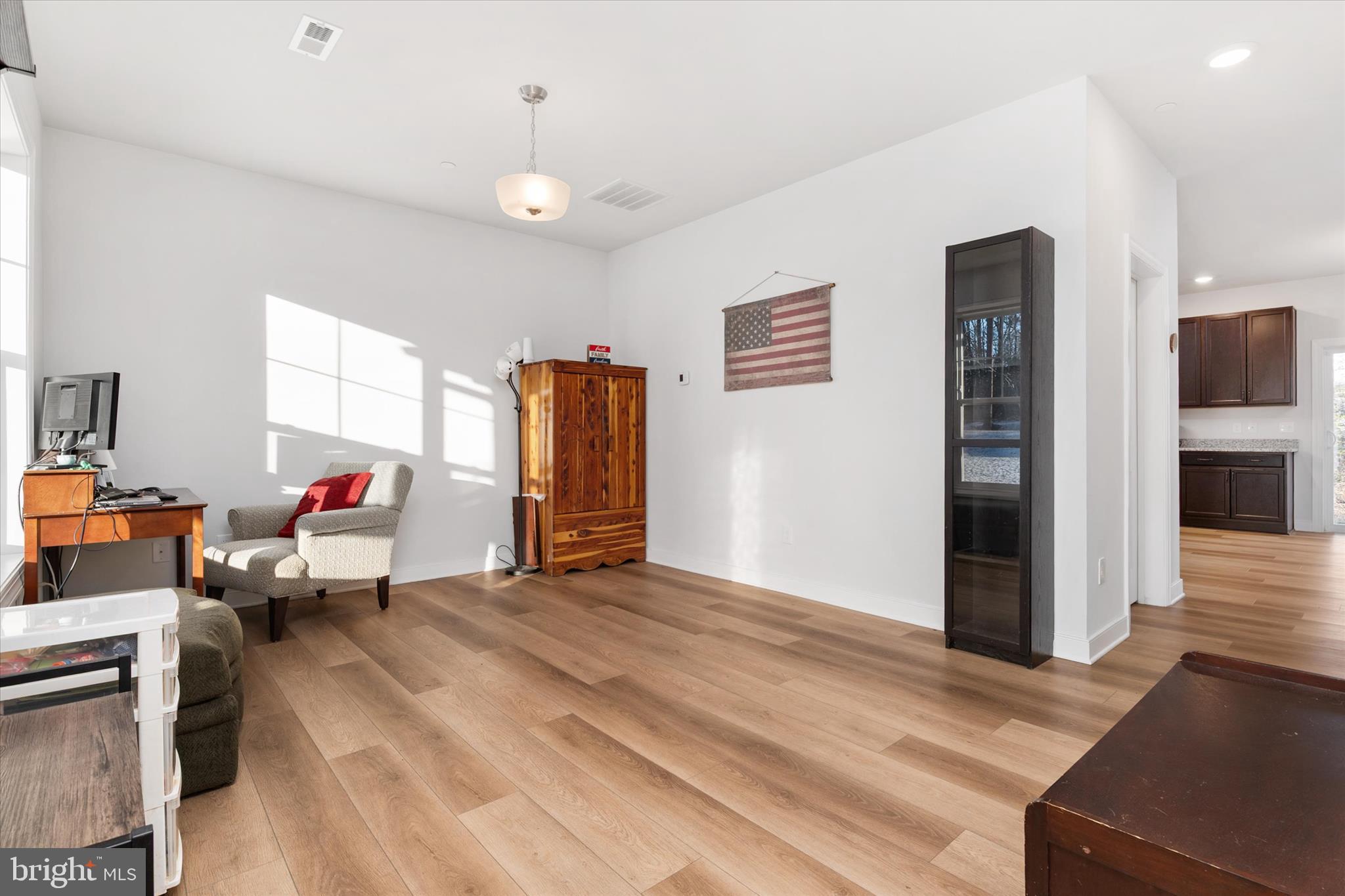 720 Bridge Drive Pasadena, MD 21122 - Photo 11 of 46 a living room with furniture and a ceiling fan