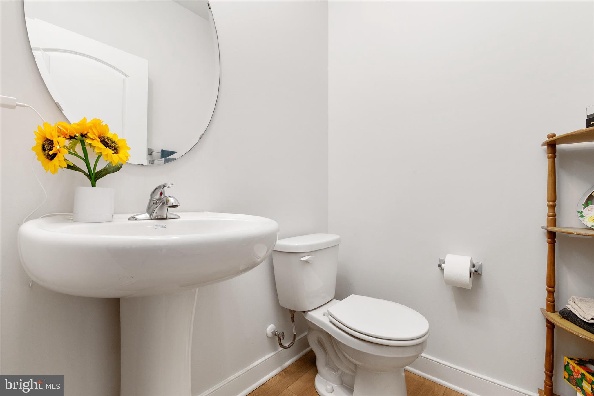 720 Bridge Drive Pasadena, MD 21122 - Photo 12 of 46 a bathroom with a sink and a toilet