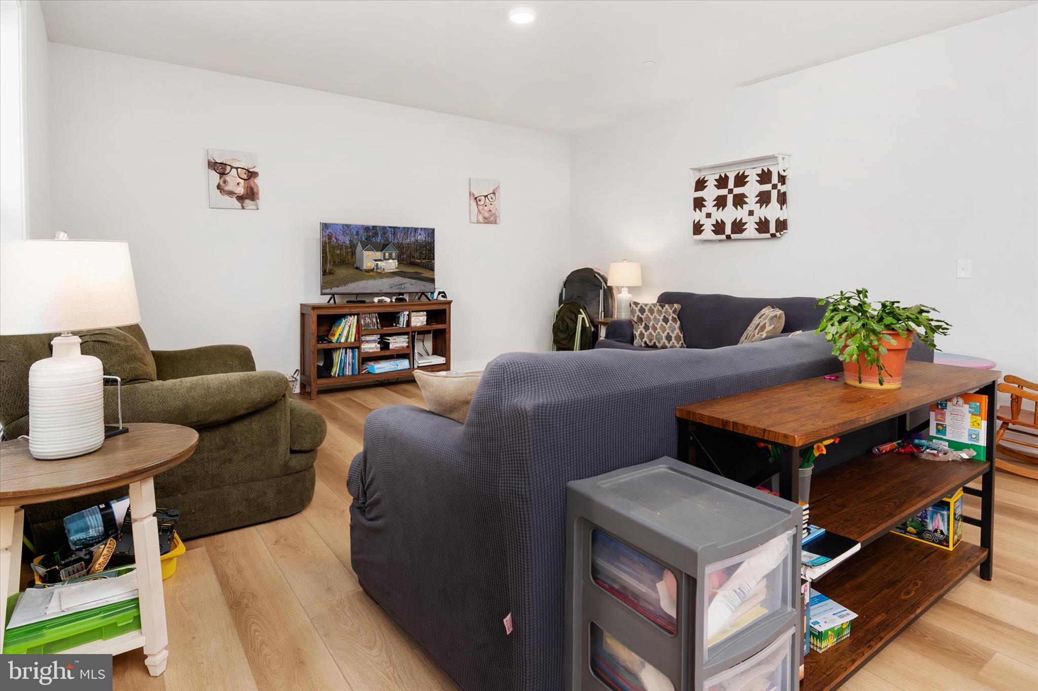 720 Bridge Drive Pasadena, MD 21122 - Photo 19 of 46 a living room with furniture and wooden floor