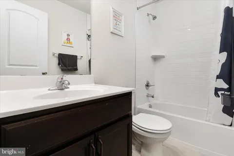 a bedroom with a bed and a table