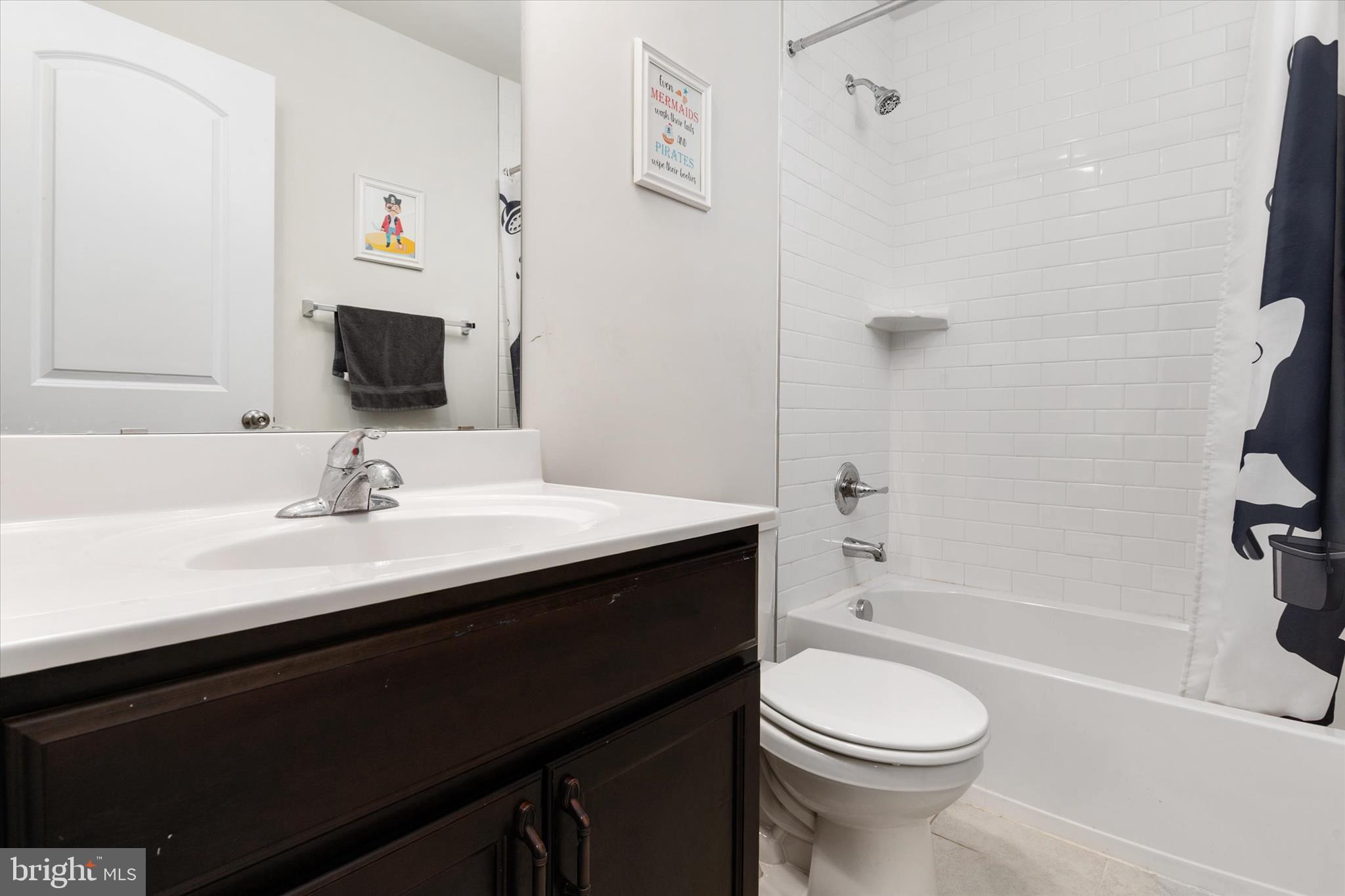 720 Bridge Drive Pasadena, MD 21122 - Photo 24 of 46 a bathroom with a sink a toilet and shower