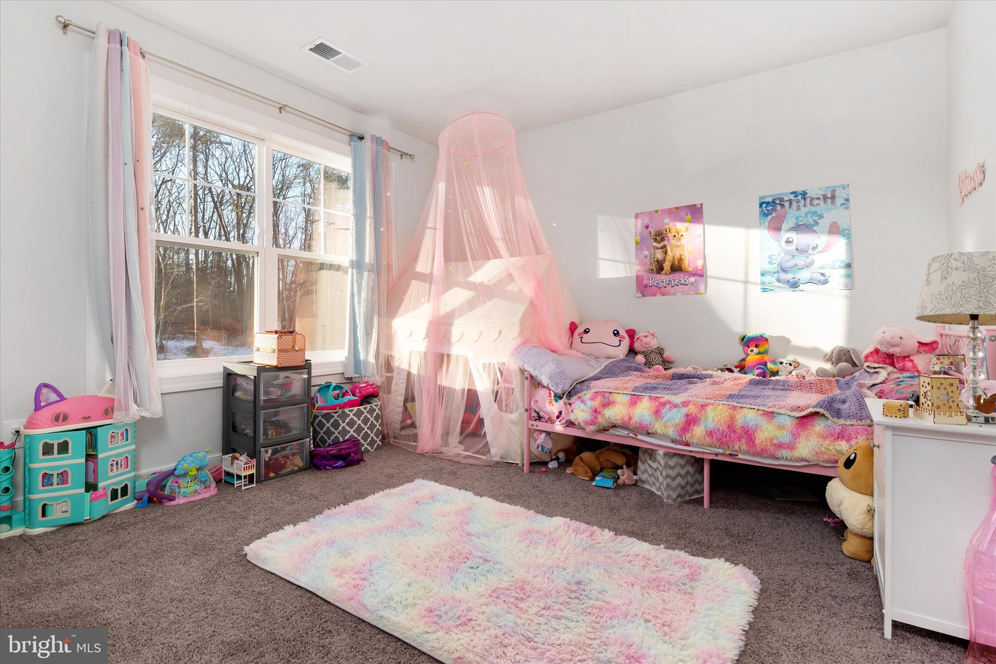 720 Bridge Drive Pasadena, MD 21122 - Photo 25 of 46 a bedroom with a bed and a table