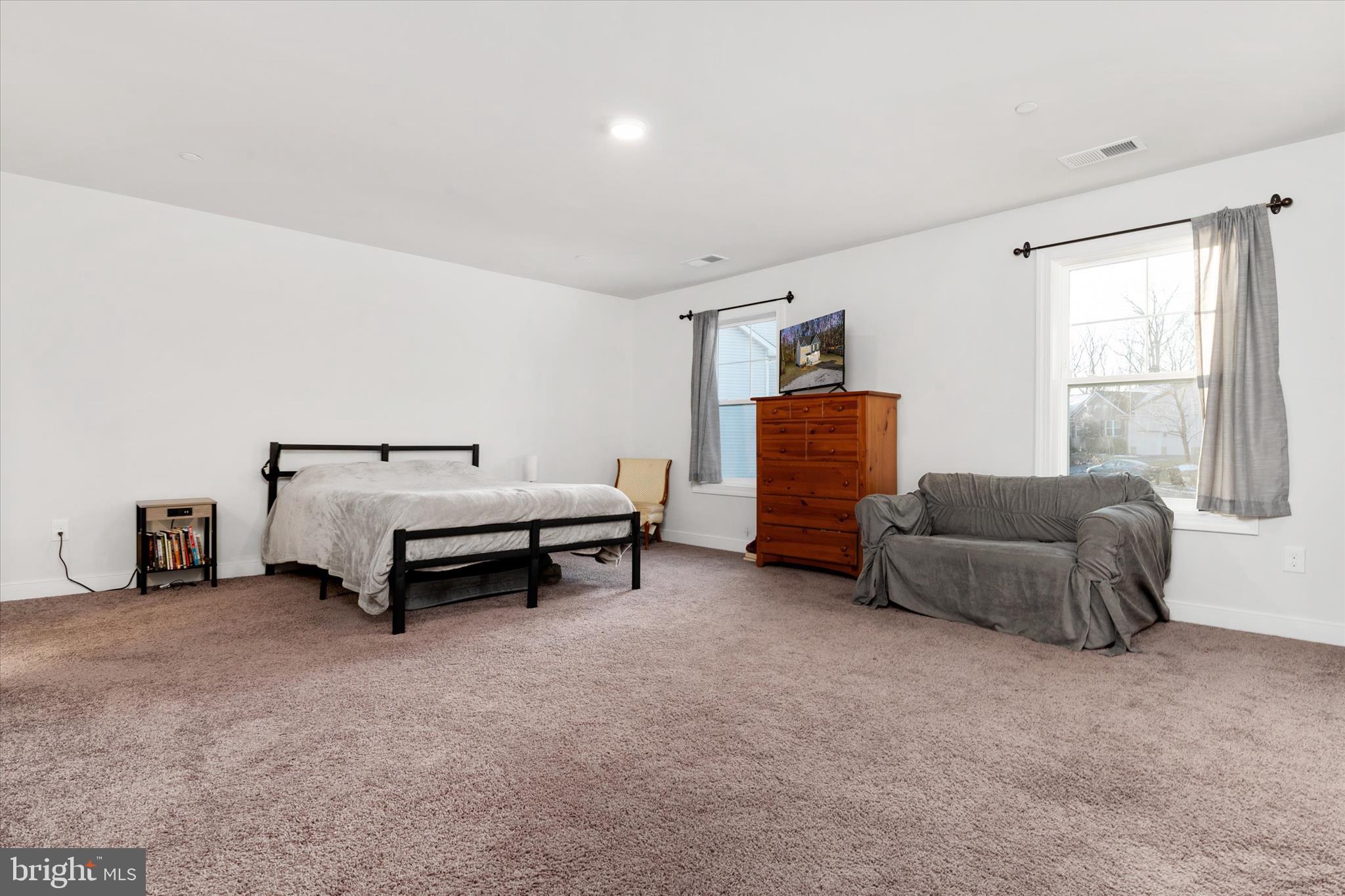 720 Bridge Drive Pasadena, MD 21122 - Photo 28 of 46 a bedroom with furniture and a couch