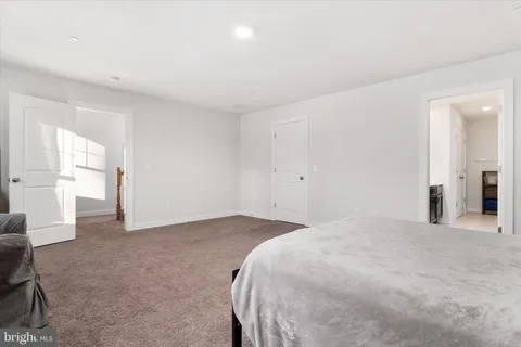 a bathroom with double sink and a mirror