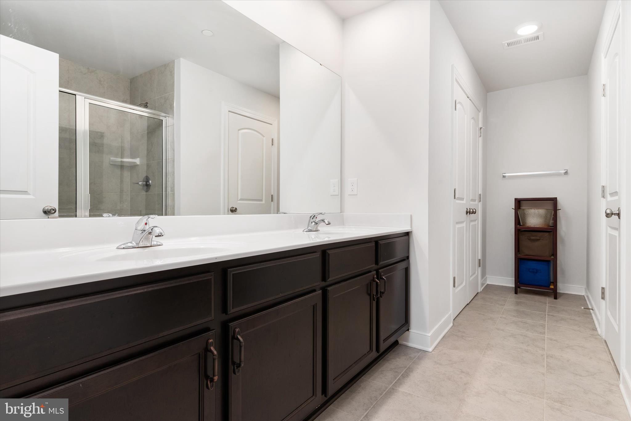 720 Bridge Drive Pasadena, MD 21122 - Photo 30 of 46 a bathroom with double sink and a mirror