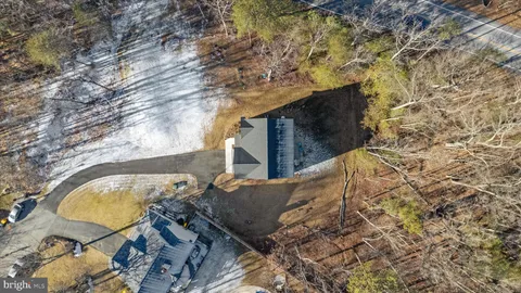 a view of swimming pool with seating area