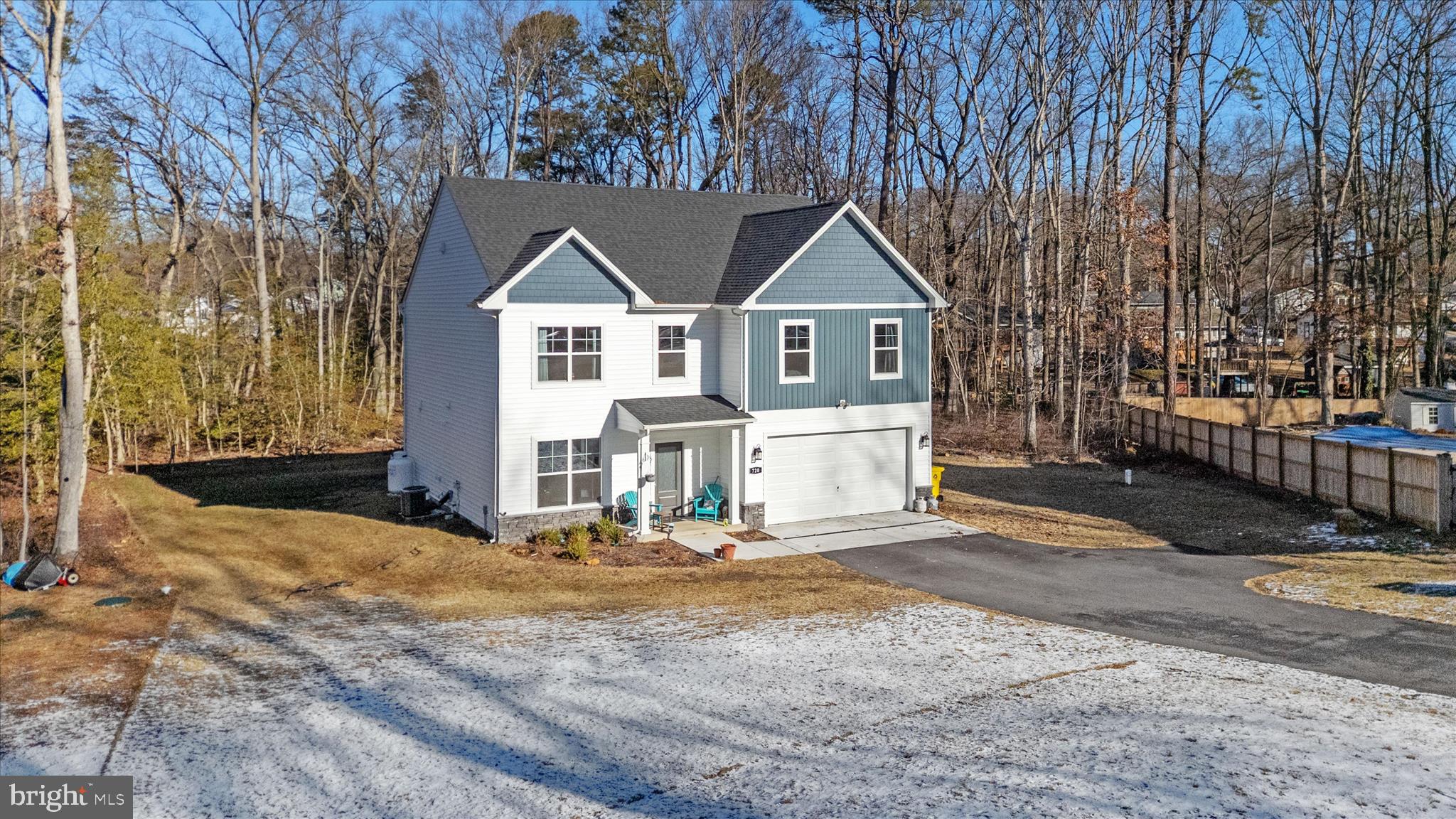 720 Bridge Drive Pasadena, MD 21122 - Photo 43 of 46 a front view of a house with a yard and garage