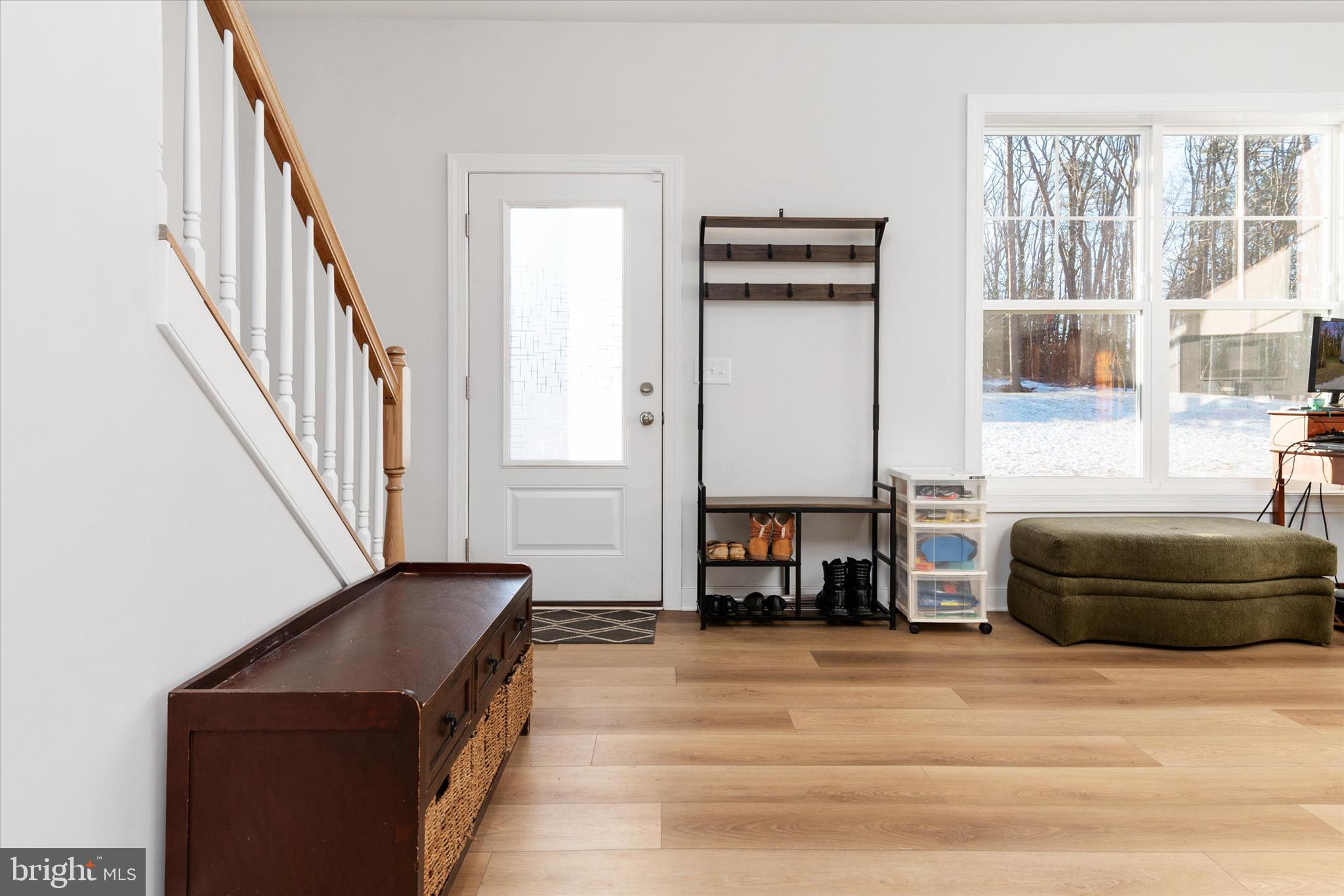 720 Bridge Drive Pasadena, MD 21122 - Photo 9 of 46 a bedroom with a bed and a large window