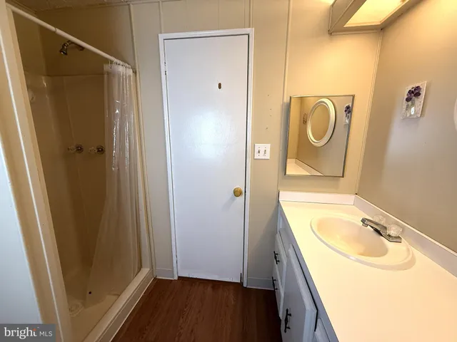 a view of a balcony with wooden floor and stairs