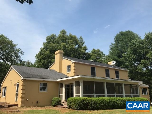 2449 Garth Road Charlottesville, VA 22901 - Photo 4 of 9 a front view of a house with a garden