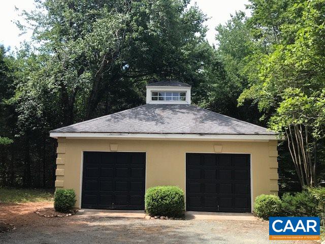 2449 Garth Road Charlottesville, VA 22901 - Photo 6 of 9 a front view of a house with a yard garage and garage