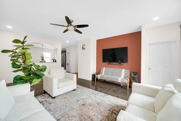 a living room with furniture and a flat screen tv