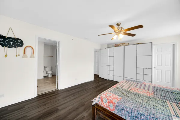 a bedroom with a bed and a walk in closet