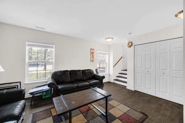 a living room with furniture and a window
